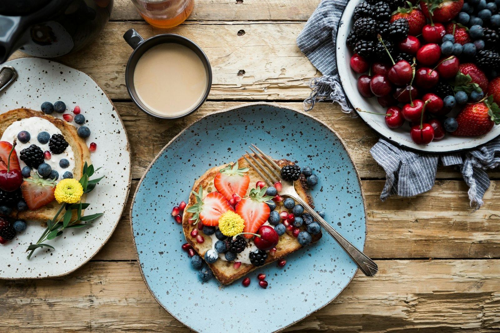 A composed breakfast table with bowls and linen