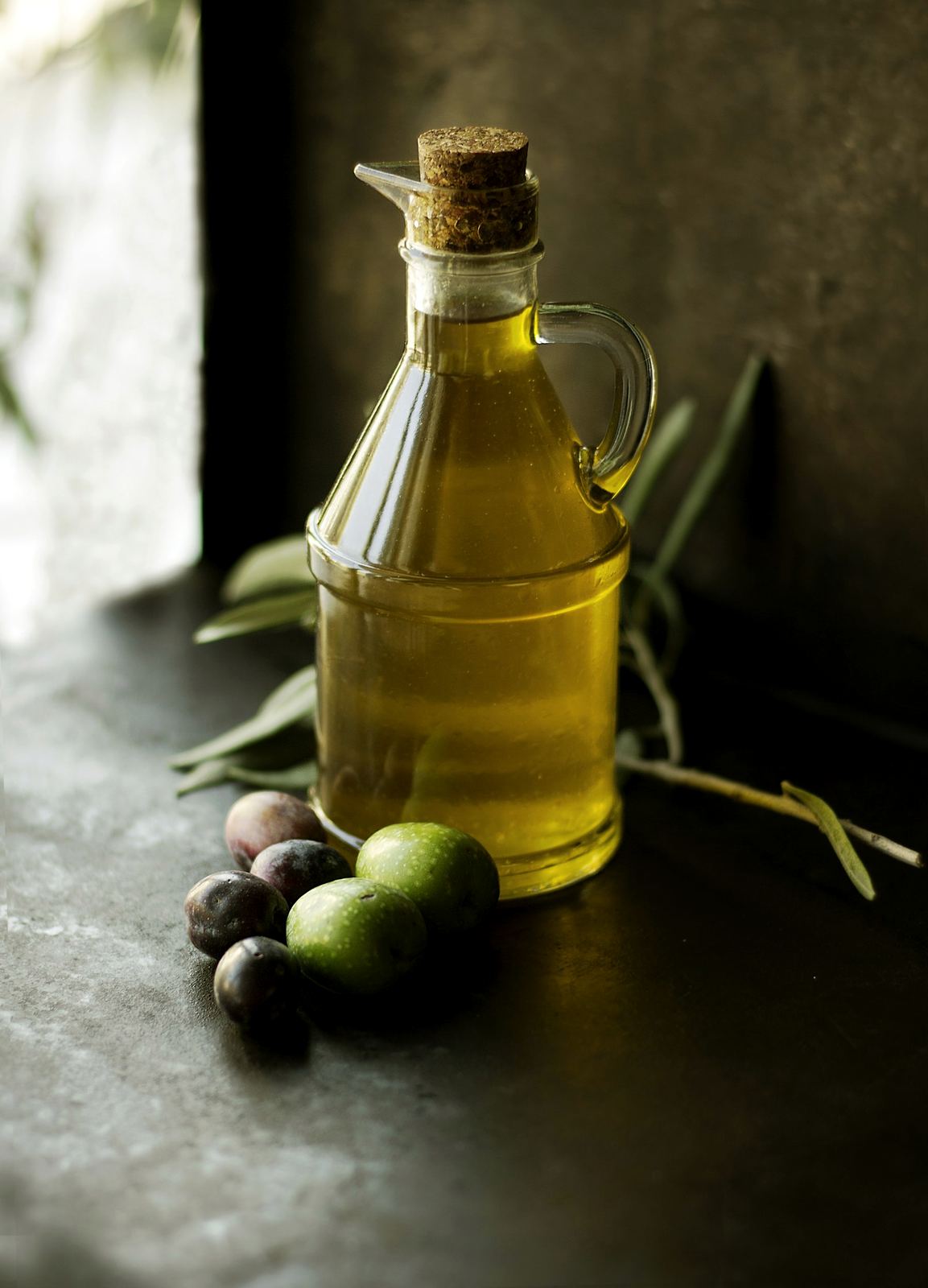 Dark glass bottles of oil and condiments