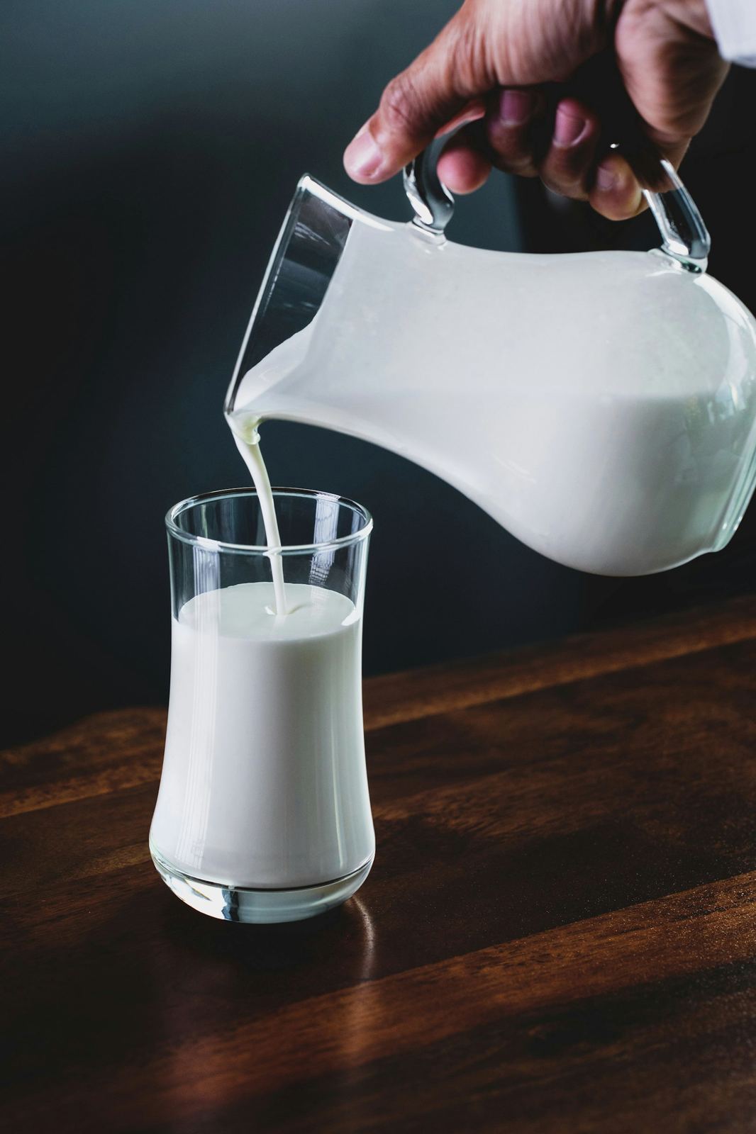 Bottles of oat milk standing in soft light